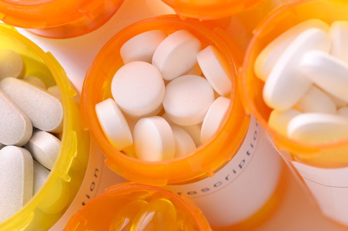 ADHD medication pills in their orange containers lined up next to each other