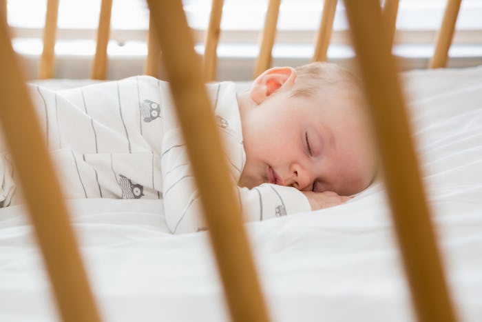 A baby sleeping in bed