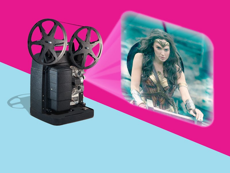 A projector showing a still of Gal Gadot as wonder woman