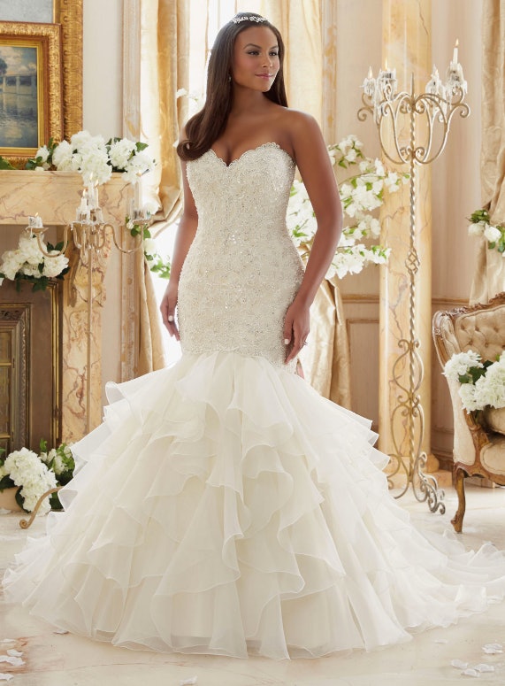 11 Plus Size Wedding Dresses That Are All Unique Absolutely Gorgeous Crystal Beaded Embroidered Lace Meets Flounced Organza Plus Size Morilee Bridal Wedding Dress Price On Ointment At Your Nearest Stockist See