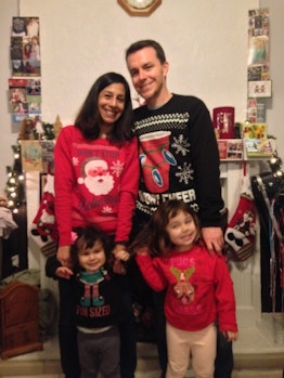 Ambrosia Brody posing with her husband and two kids while wearing Christmas inspired clothes