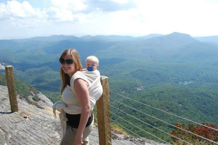 Elizabeth Broadbent  on a hike with her newborn baby in a back baby carrier