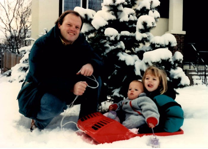 The author, Claire Shefchik as a child with her blogger father and a sibling posing in front of a th...