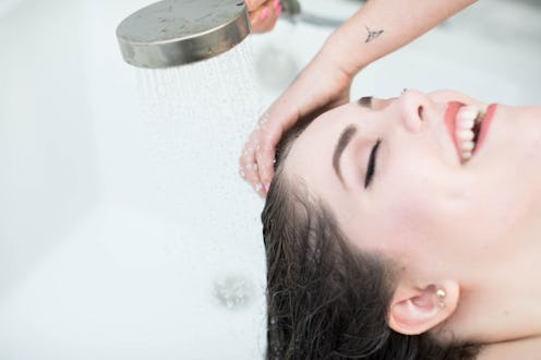 A woman having her hair washed at the hair salon