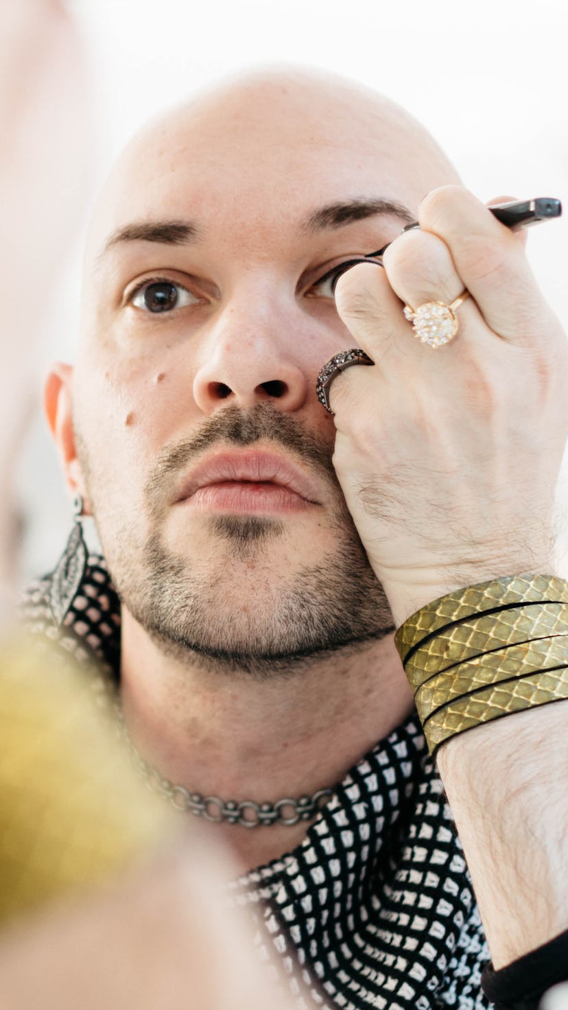 A person applying eyeliner and that defines their womanhood