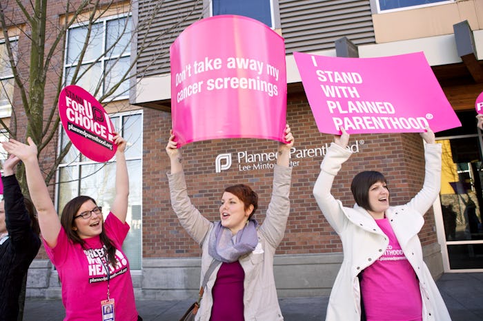 Mothers protesting against Title X funding cuts on a street