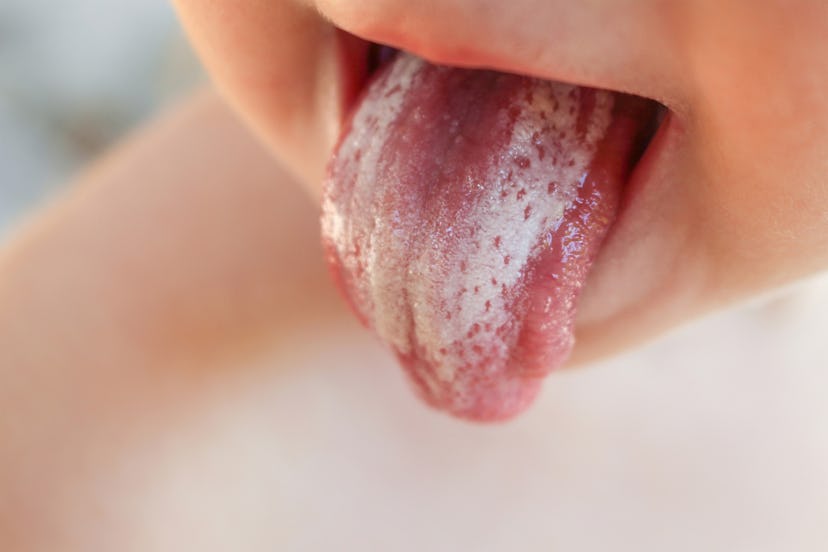 A child sticking its tongue out
