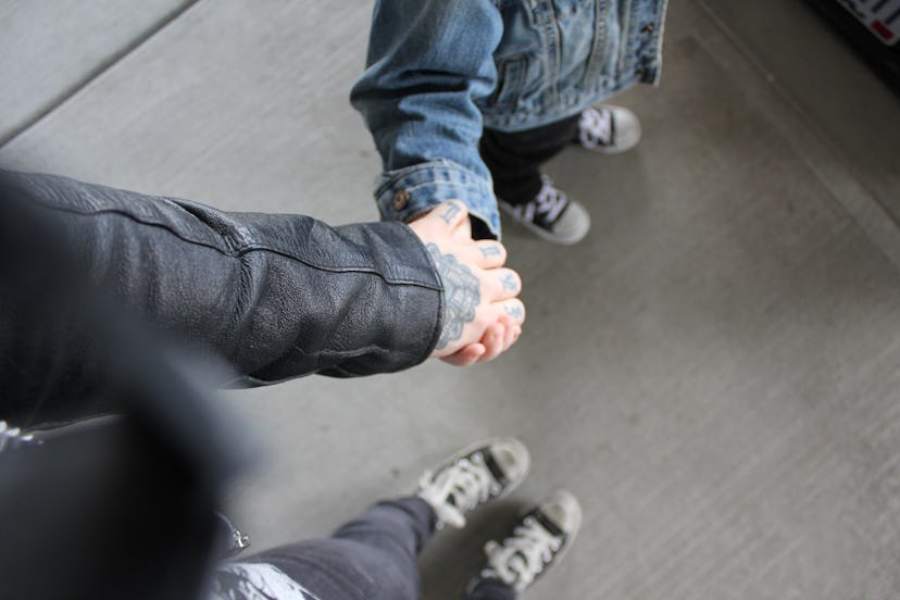 Elle Stanger holding hands with her daughter