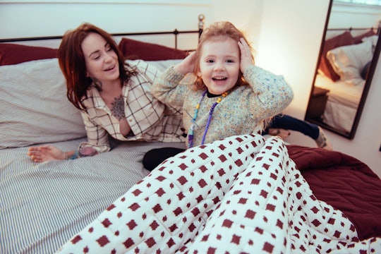 Krystyna Solodenko on her bed with her child