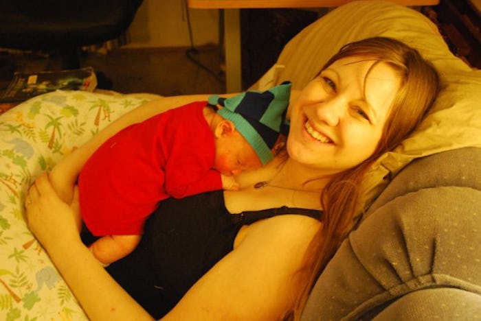 Baby sleeping on the chest of its mother after breastfeeding