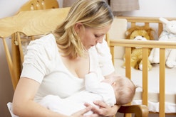 A blonde woman breastfeeding her baby after D-MER