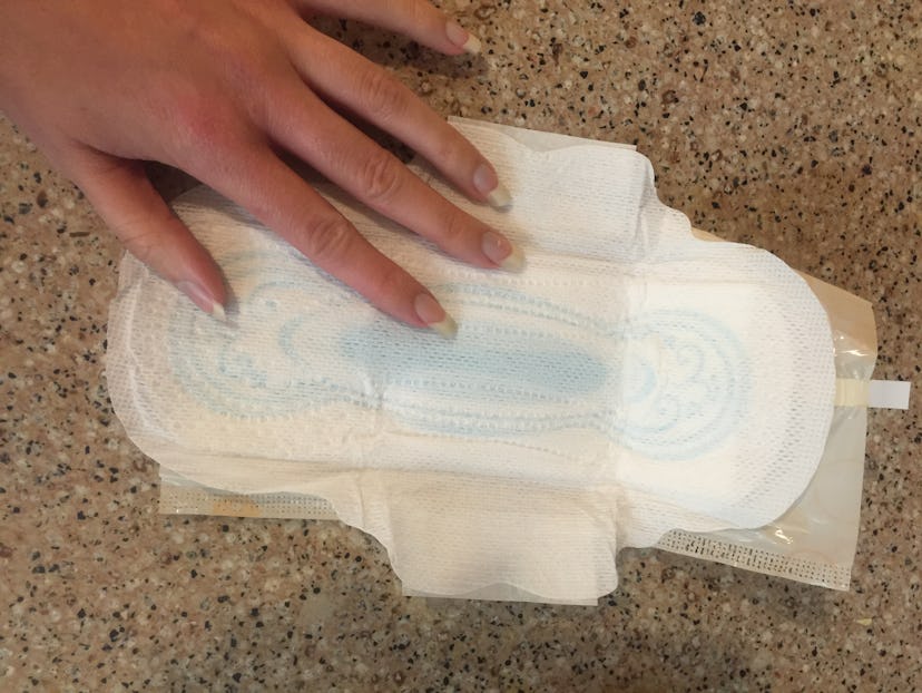 Woman's hand on a cut pad 