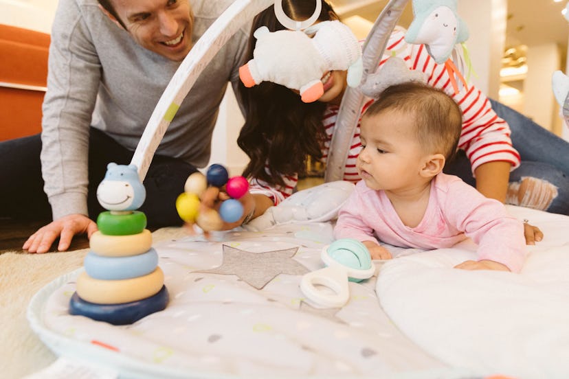 Parents and baby playing with toys