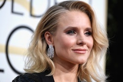 Kristen Bell with a side-hair part and large diamond earrings at a red carpet event