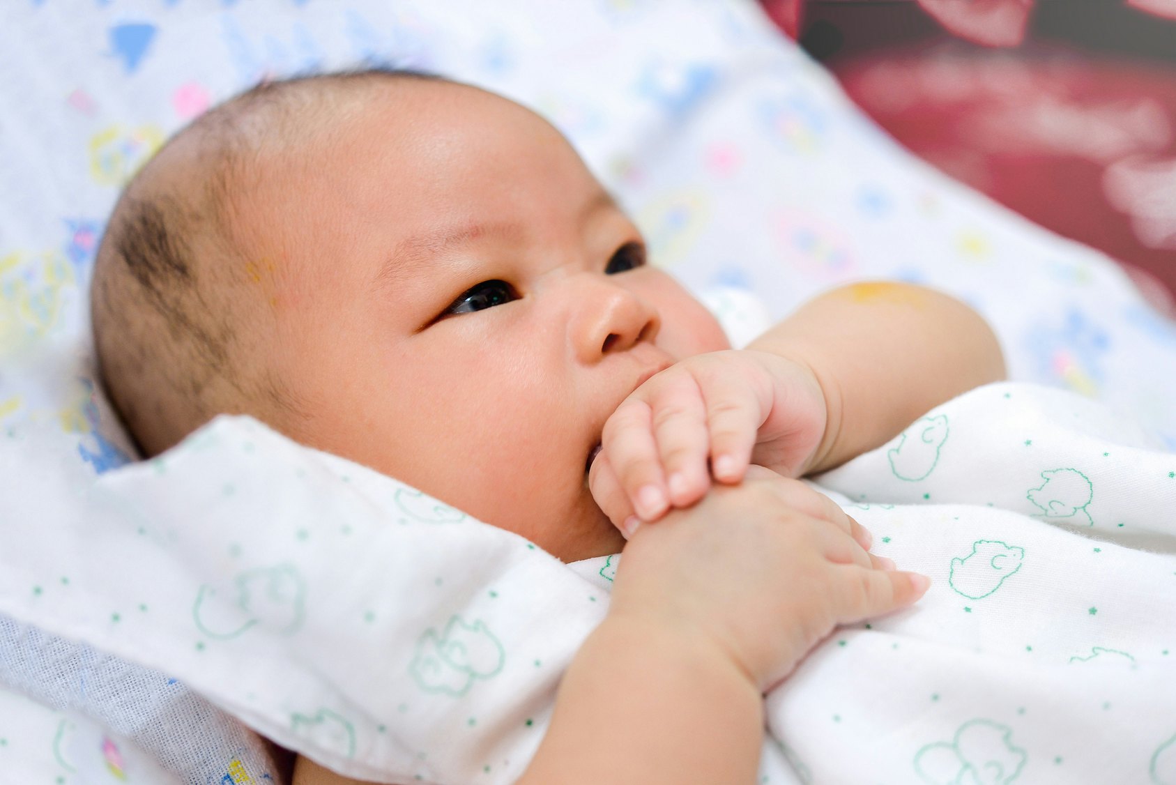 Fussy baby chewing cheap on hands