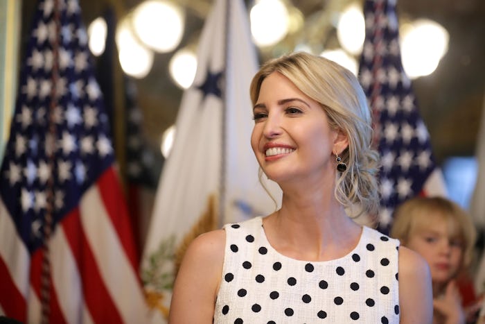 Ivanka Trump in a white dress with black polka dots smiling into the distance