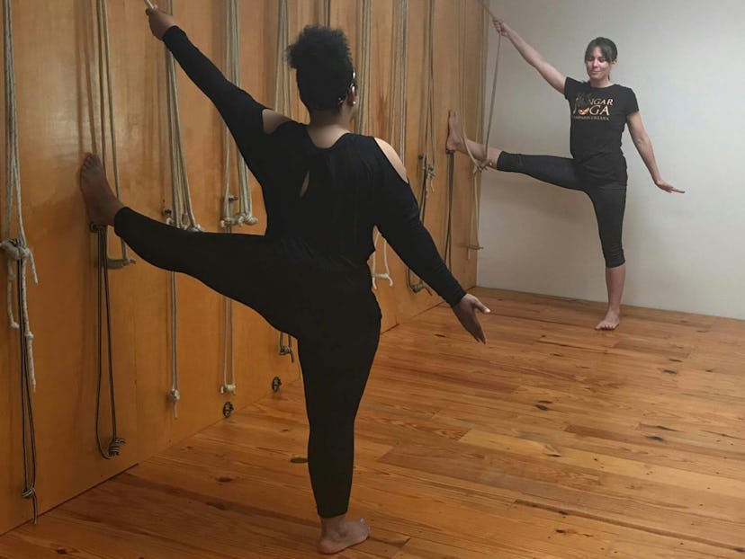 Kelly doing Supported Utthita Parsva Padangusthasana yoga pose.