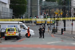 Police officers and yellow tape at the Manchester attack scene