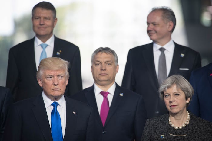 An insert from the video of Donald Trump pushing a PM at NATO