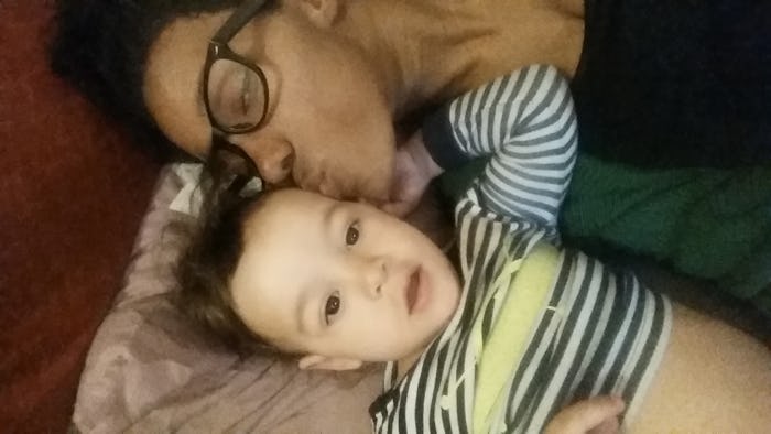A mother kissing her baby
