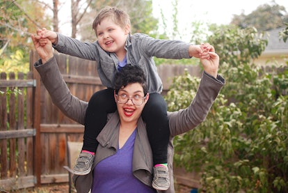 B R Sanders with her son on her shoulders