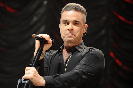 Robbie Williams performing at One Love Manchester