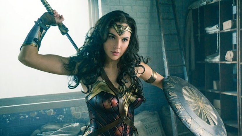 Gal Gadot as Wonder Woman, holding a sword and shield