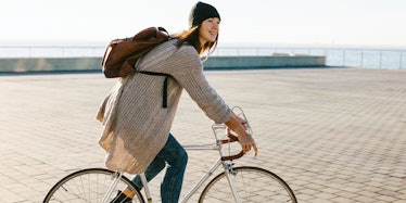 A woman riding a bike to work as a way of switching up her daily commute
