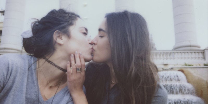 A pair of lesbian brunettes making sweet love