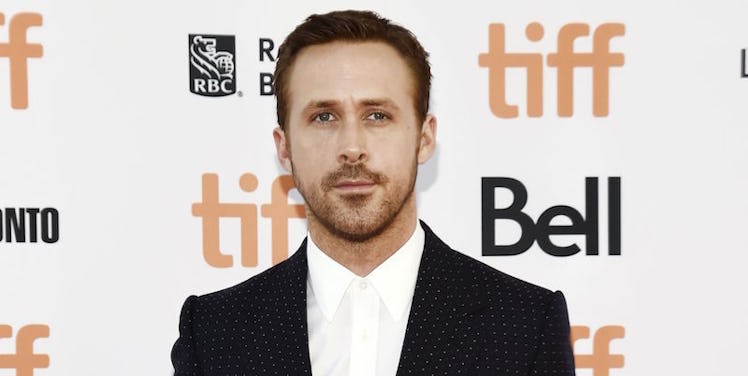 Ryan Gosling in a black blazer and white button-up 