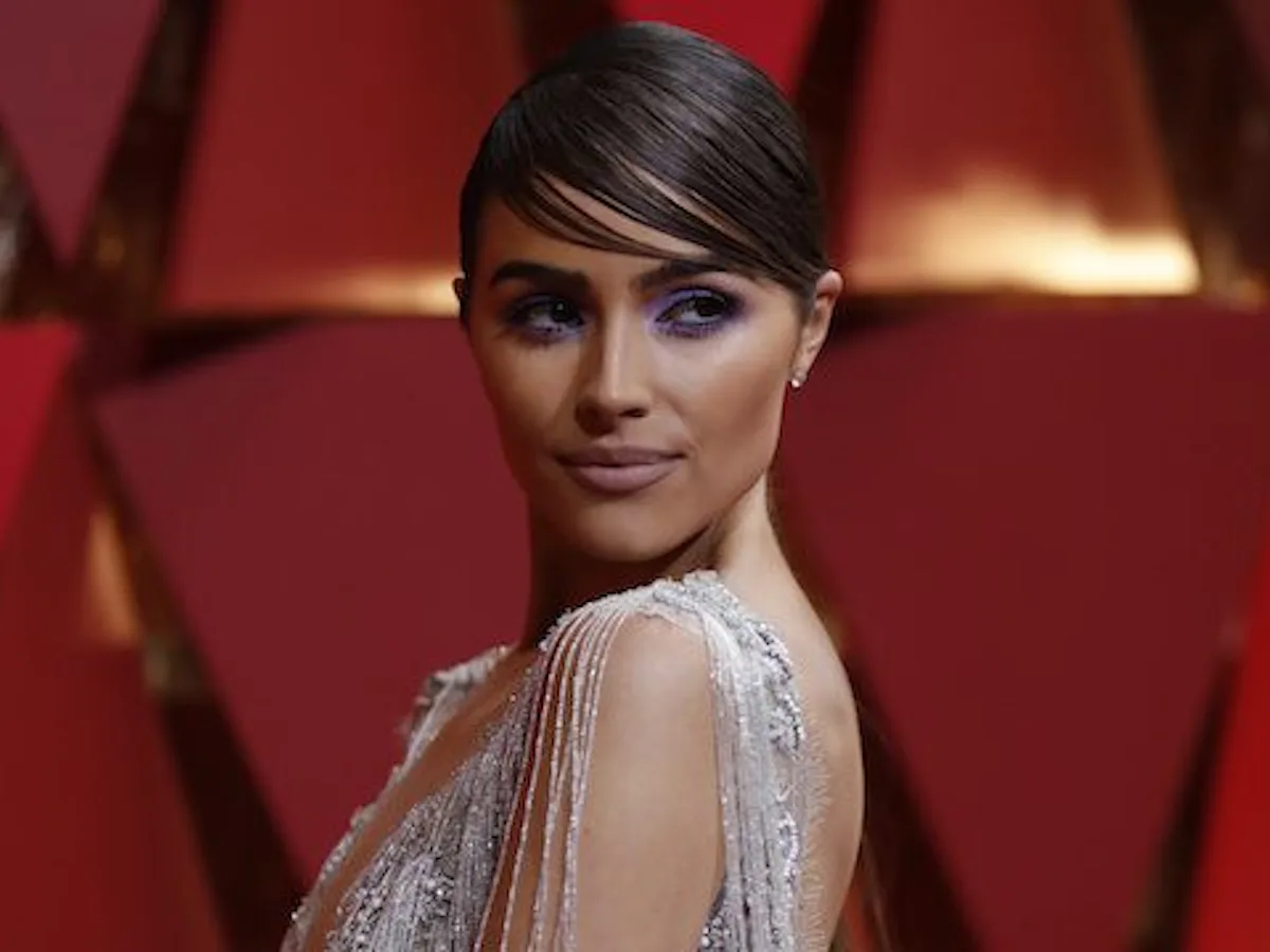 olivia culpo dress designer oliviaculpo and @christianmccaffrey are married! The model and former Miss Universe walked down the church aisle in Watch Hill, Rhode Island in a long-sleeve crepe crew neck ball gown with a voluminous