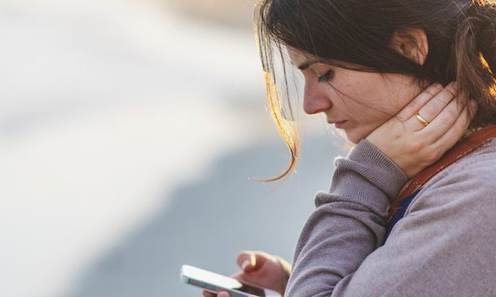 Image result for sad person looking at phone