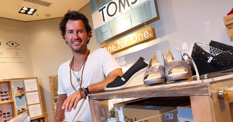 Blake Mycoskie in a TOMS store, smiling