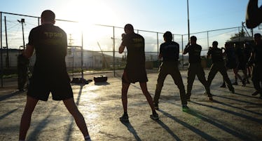 A group of people training Krav Maga during the day