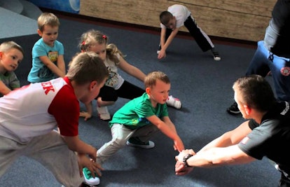A Krav Maga expert training a group of kids