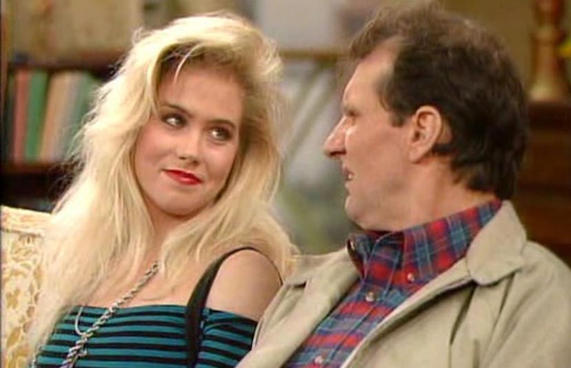 Daughter and father, Kelly and Al Bundy sitting and talking