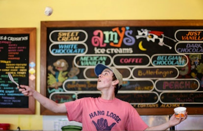 A man preparing an ice cream meal at Amy’s Ice Cream in Austin