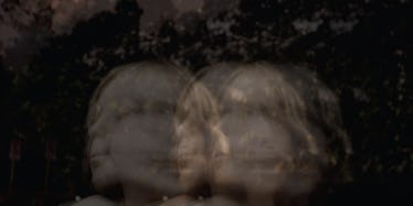 A blurred kid shaking its head