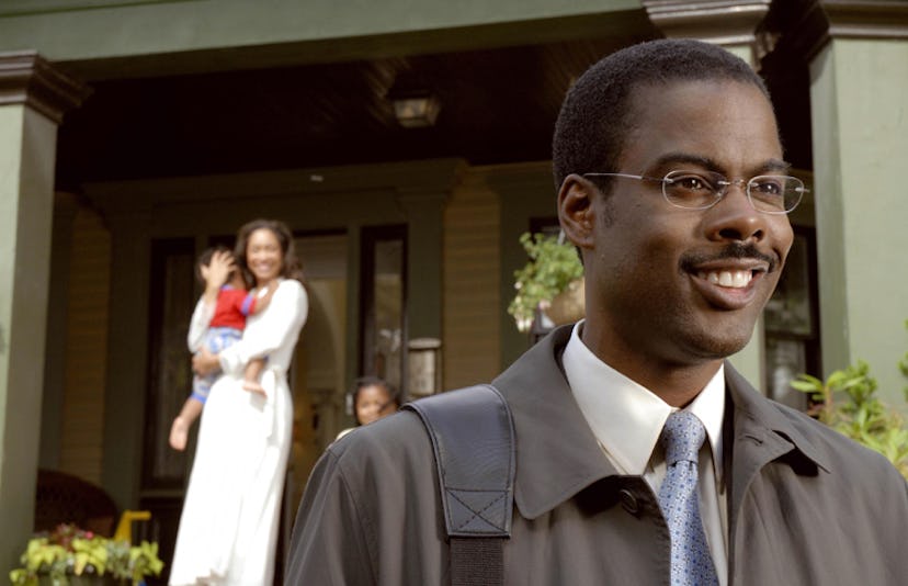 Chris Rock leaving a house with a woman holding a child behind him in "I Think I Love My Wife"