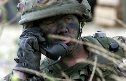 Army Soldier On Phone In The Field