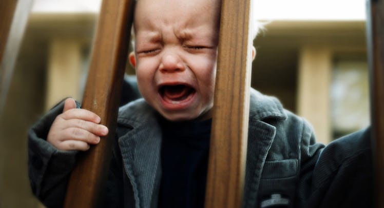A baby crying in their crib.