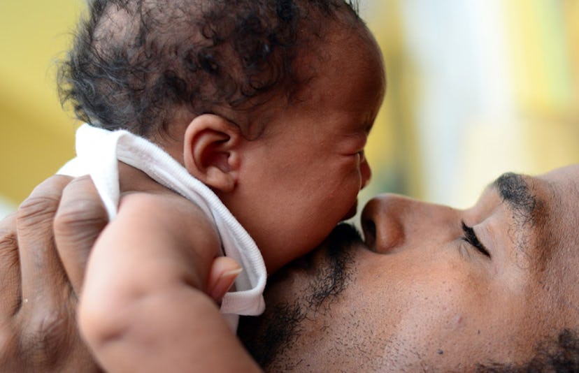 baby crying with his father