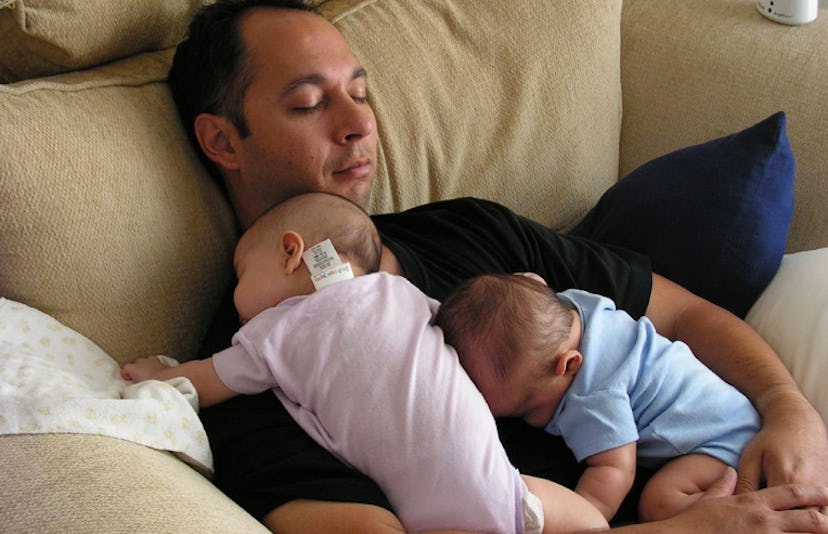 Father sleeping with his two twin kids
