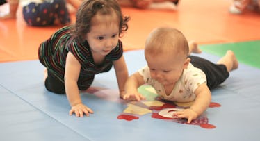 babies playing together