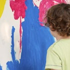 child painting on walls