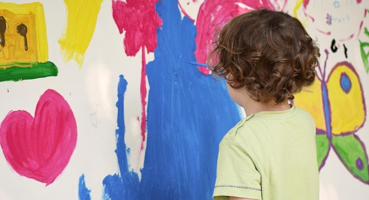 child painting on walls