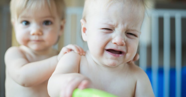 crying baby and sibling