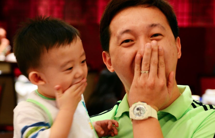 father and son laughing