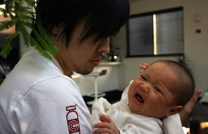 man and crying baby