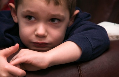 pensive child on couch